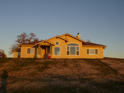 MP in front of house
