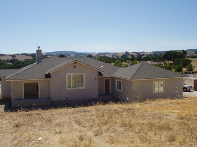 Back of house with stucco